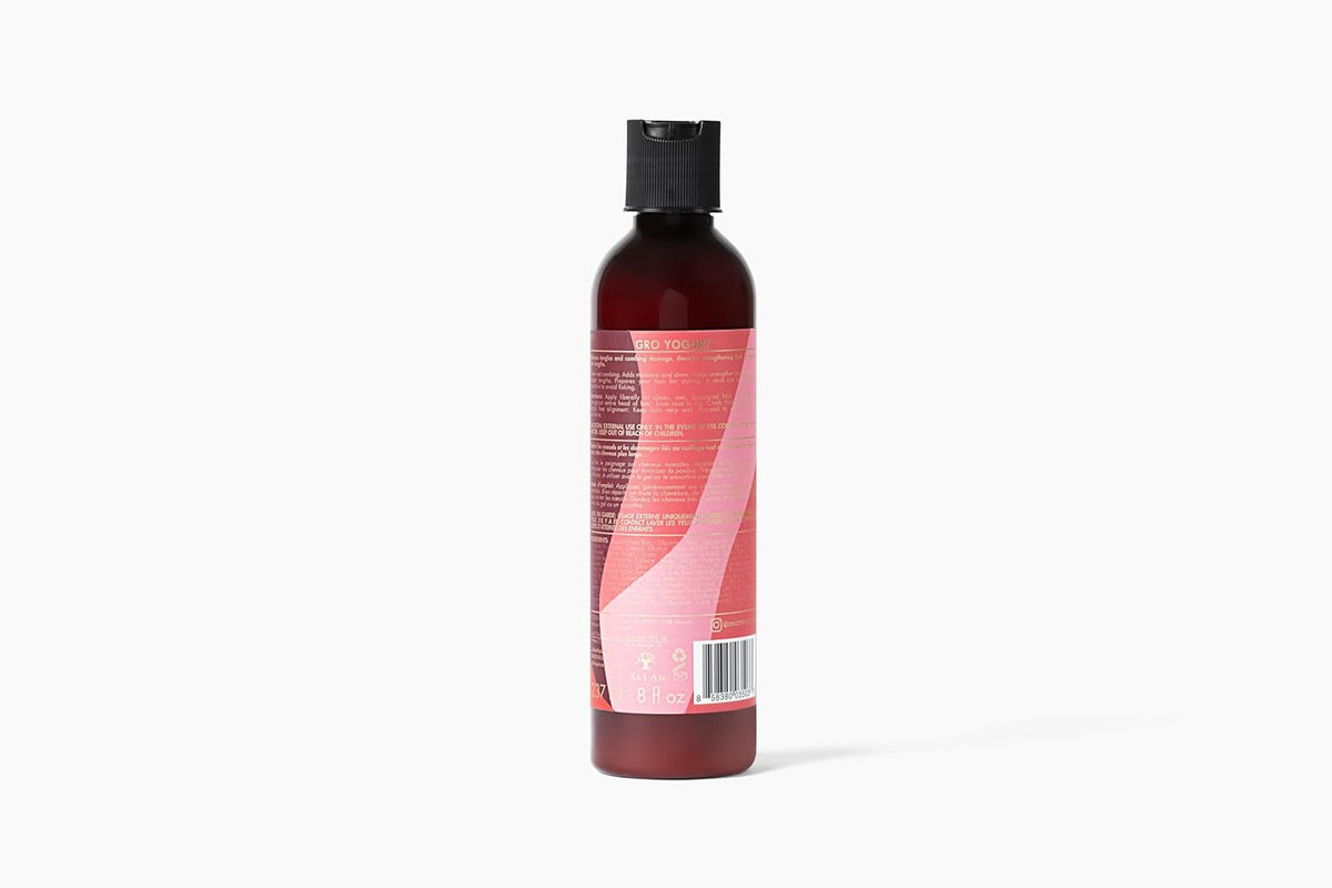 Bagsiden af en brun flaske As I Am Long & Luxe GroYogurt Leave-in Conditioner (237 ml) med en lyserød etiket, der viser ingredienser og brugsanvisning.